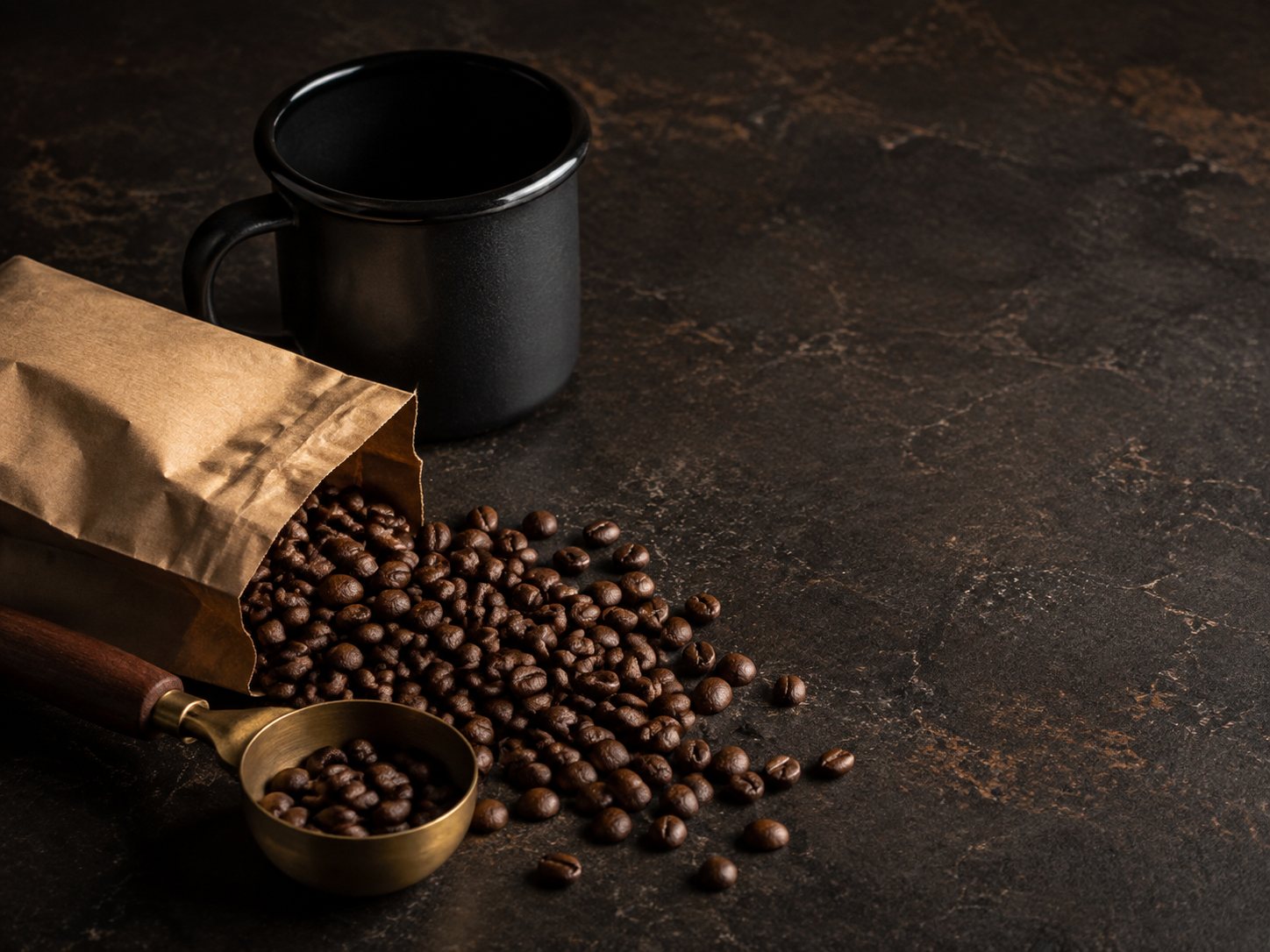 Roasted coffee beans with a scoop and mug